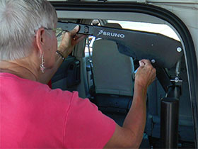 Woman using the Bruno Curb-Sider's Quick-Release Pin